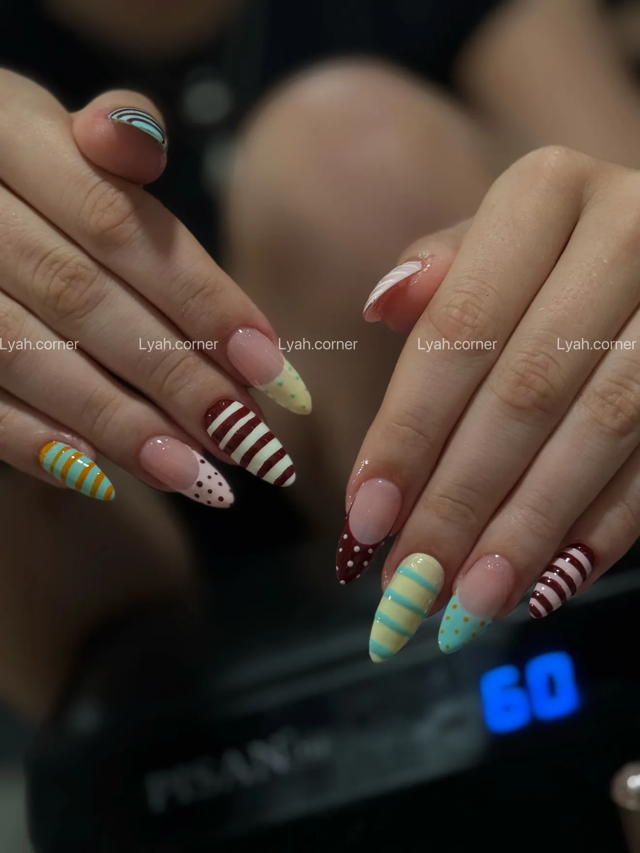 Hand-painted candy stripes on natural nails